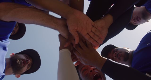 Team Huddle Unity in Blue Jerseys Celebrating Victory - Download Free Stock Images Pikwizard.com