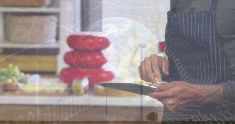 Modern Chef using Digital Tablet in Professional Kitchen