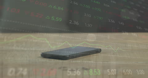 Stock Market Analysis with Smartphone on Wooden Surface