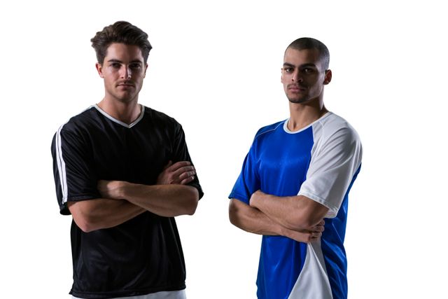 Two male football players standing with arms crossed, wearing black and blue uniforms, against a white background. This image can be used for sports-related content, team promotions, athletic advertisements, or articles about football and teamwork.