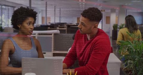 Colleagues Collaborating in Open-Plan Office with Transparent Code Views