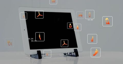 White tablet showing floating orange hud interface and data icons on glossy minimal desktop