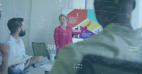 Woman Presenting Colorful Infographic Slide During Team Analytics Meeting with HUD Overlay