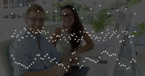 Creative office collaboration with graphics tablet in modern workspace