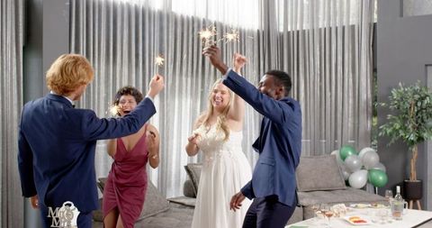 Joyful Multiracial Wedding Reception with Sparklers