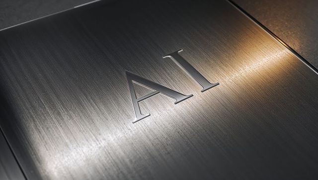 Brushed stainless panel embossed ai letters under warm directional light