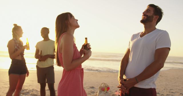 Friends Enjoying Beach Sunset with Drinks - Download Free Stock Images Pikwizard.com