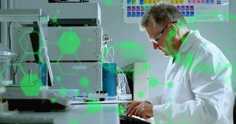 Typing scientist entering data at lab workstation with analytical gear and molecular HUD