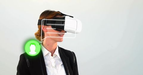 Businesswoman embracing technology with virtual reality headset