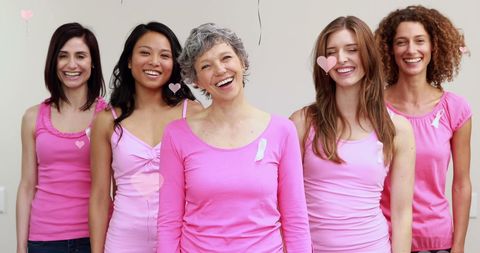 Smiling Women in Pink Supporting Breast Cancer Awareness