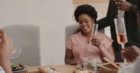 Joyful Celebration with Friends at Cozy Dinner Party