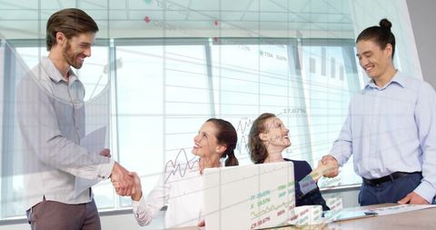 Diverse Coworkers Collaborating with Stock Market Data