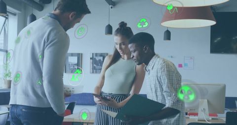 Diverse Team Collaborates with Eco-Friendly Concepts at Office