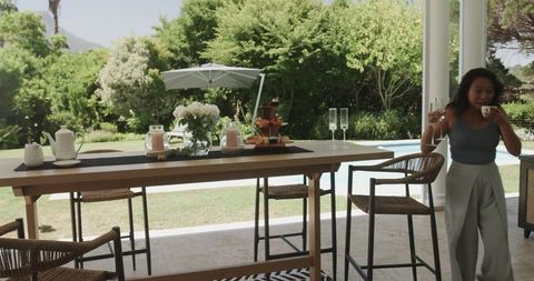 Joyful Outdoor Celebration with Friends Near Pool