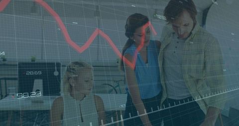 Team Analyzing Financial Data in Open Office Workspace