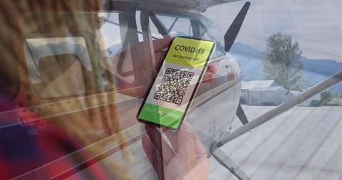 Covid-19 vaccination pass displayed at airport with private aircraft
