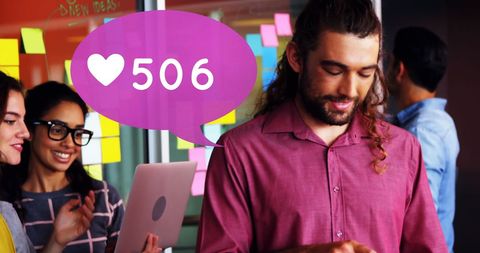 Team collaborating with social media engagement metrics displayed