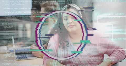 Typing woman collaborating on laptop with glitch HUD overlay, coding coworking focus