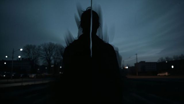 Silhouette of Adult Male in Urban Twilight Setting