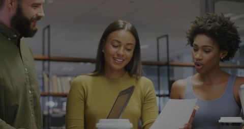 Diverse Team Reviewing Document in an Office Environment