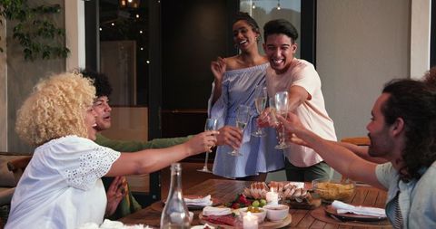 Diverse Friends Toasting at Festive Dinner Celebration