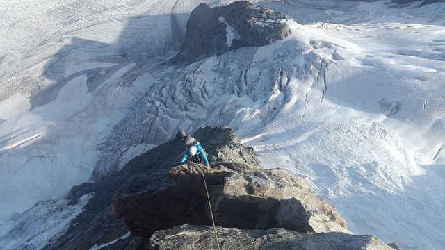 Climber Scaling Icy Summit in Breathtaking Mountain Landscape - Download Free Stock Photos Pikwizard.com