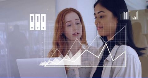 Female Colleagues Collaborating on Data Analytics Dashboard, Reviewing Charts on Laptop