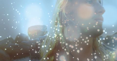 Ethereal Figure Amidst Sparkling Seaside Scene