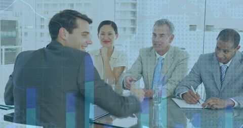 Shaking hands across glass table with financial data overlay during corporate meeting