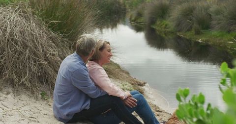 Senior Caucasian Couple Embracing by Riverside - Download Free Stock Images Pikwizard.com