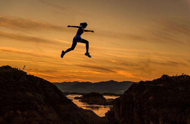 Man Jumping on Landscape at Sunset - Download Free Stock Photos Pikwizard.com