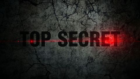 Top secret lettering on cracked concrete with red laser line, grunge industrial background