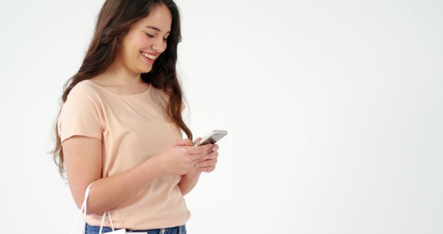 Smiling Woman Using Smartphone with Shopping Bags - Download Free Stock Images Pikwizard.com