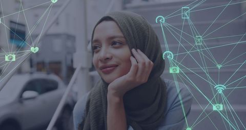 Smiling Hijab Woman Surrounded by Digital Media Network Icons