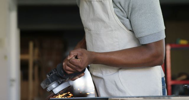 Man Using Angle Grinder in Workshop, Welding Sparks Flying - Download Free Stock Images Pikwizard.com