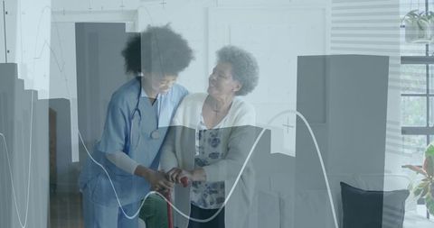 Caregiver assisting senior woman with walker in living room