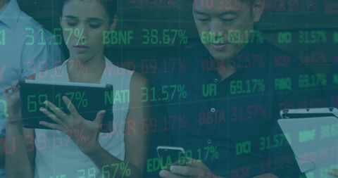 Business professionals analyzing financial stock data on electronic devices