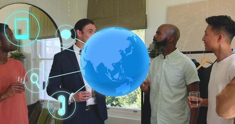 Collaborating around holographic globe in modern loft networking event with wardrobe rack and drinks