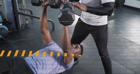 Dumbbell bench press training with spotter guiding form and strength coaching