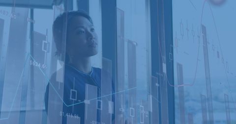 Financial Analyst Examining Virtual Data Charts in Corporate Setting