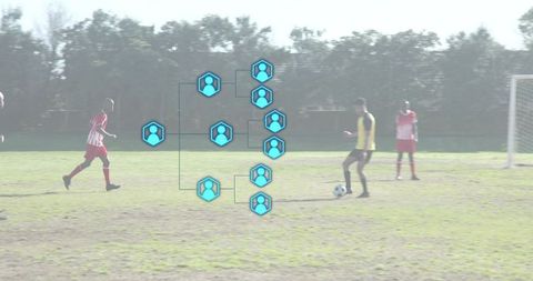 Dribbling young soccer player wearing yellow bib with tournament bracket overlay on field
