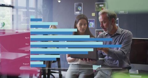 Business Team Analyzing Data Visually with Overlapping Bar Charts