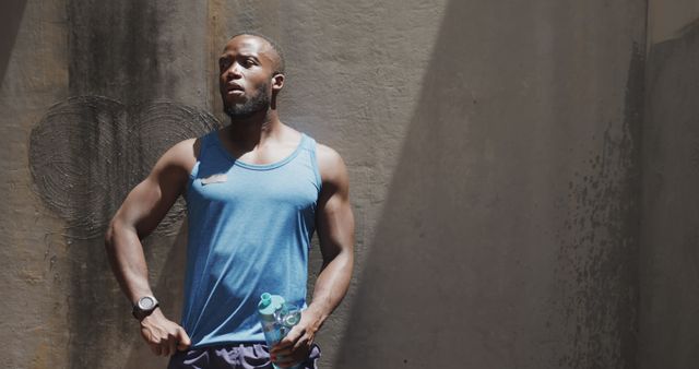 Athletic Man Pausing During Outdoor Workout in Sunlight - Download Free Stock Images Pikwizard.com