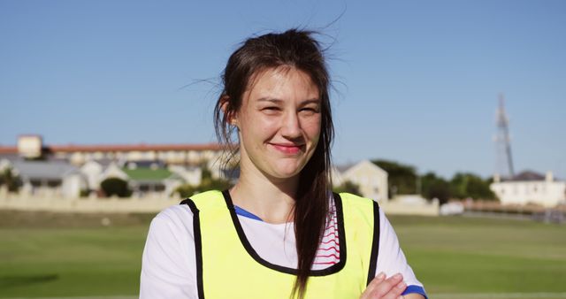 Confident Female Athlete Standing on Soccer Field in Training Gear - Download Free Stock Images Pikwizard.com