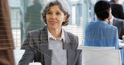 Senior Businesswoman with Futuristic Tunnel Overlay in Café Setting
