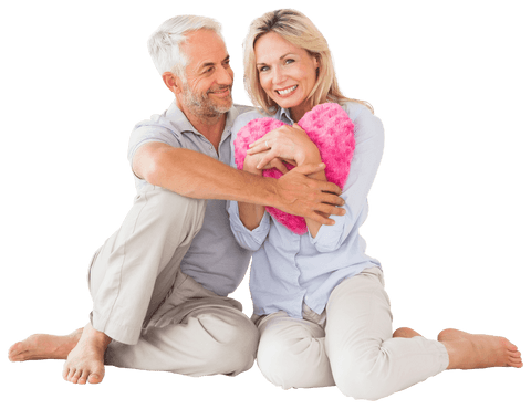 Happy Mature Couple with Heart Pillow, Embracing Love on Transparent Background