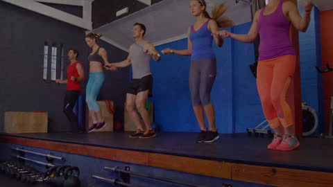 Group Fitness Enthusiasts Engaging in Jump Rope Workout