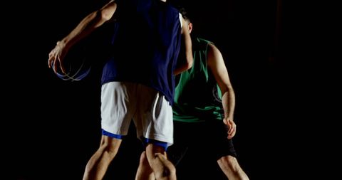 Intense Nighttime Outdoor Basketball Game