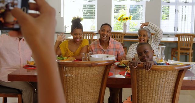 Cheerful African American Family Posing for a Group Photo at Dining Table - Download Free Stock Images Pikwizard.com