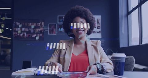 Executive woman analyzing holographic data at modern office desk with notebook and coffee